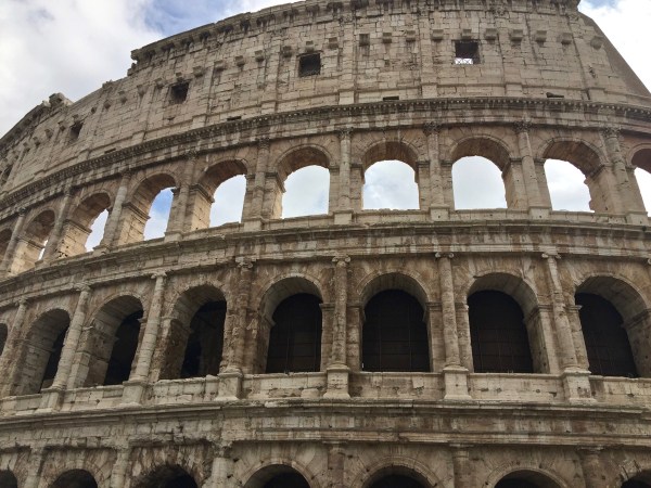 The outside of the Colosseum with all of the arches