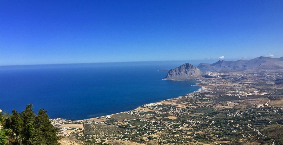 view from the cabe car looking down the rolling hills down to the sea