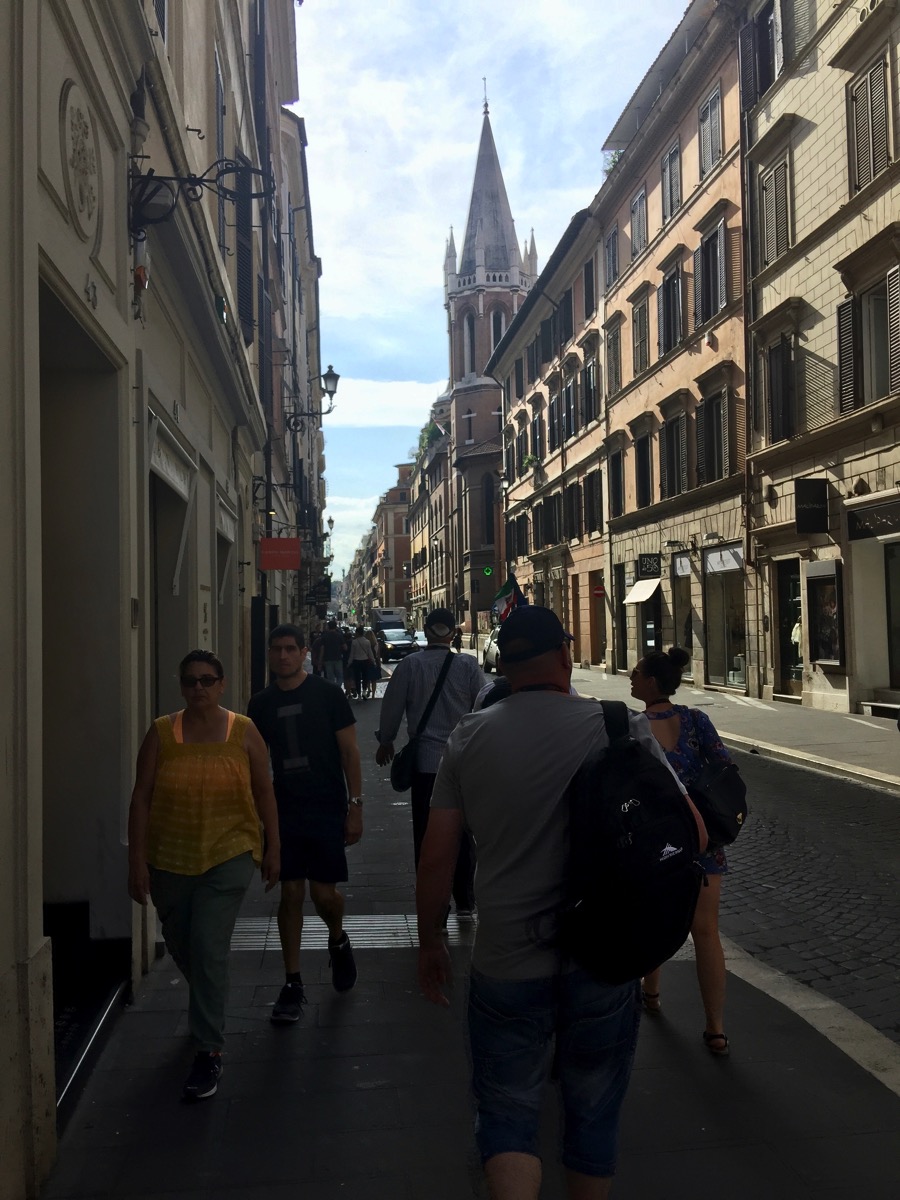 Walking along the left hand side of a street behind our group