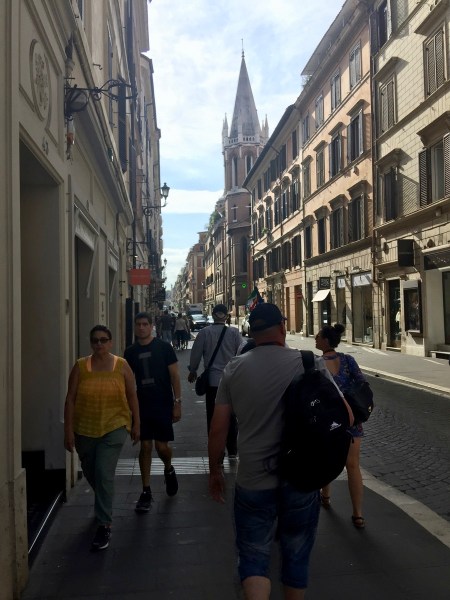 Walking along the left hand side of a street behind our group