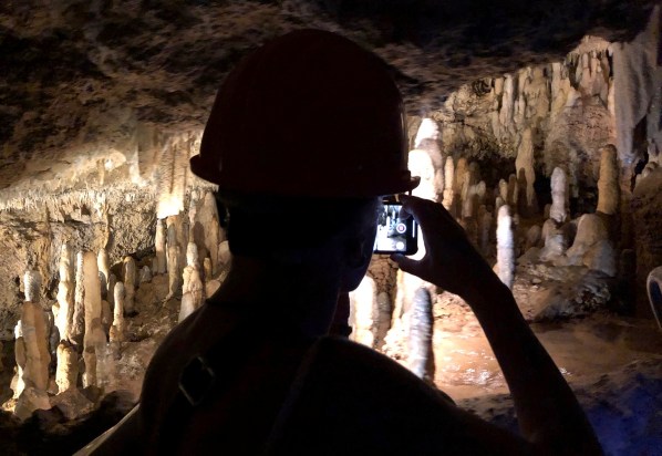 view of Harrison's cave in the dark with mood lighting