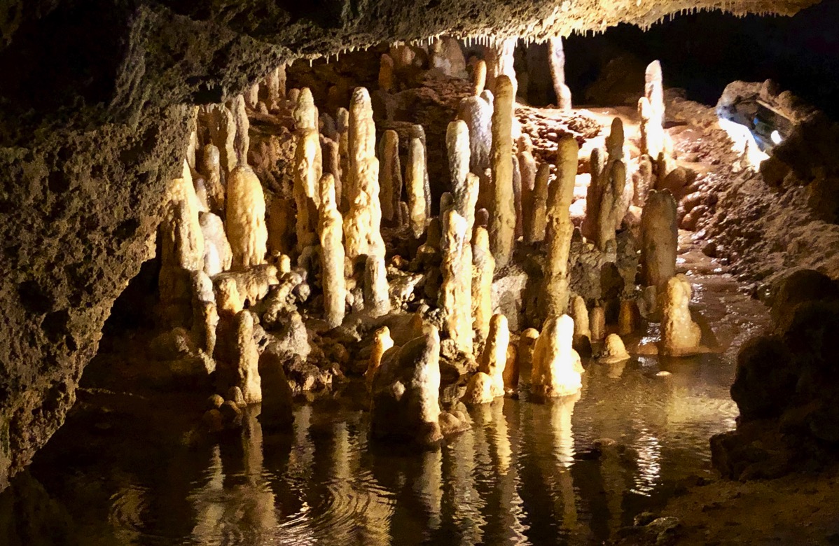 Harrison's cave in the dark with the lighting and running water