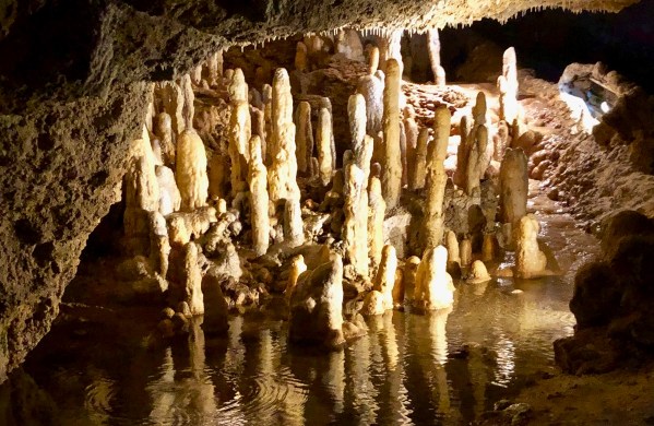 Harrison's cave in the dark with the lighting and running water