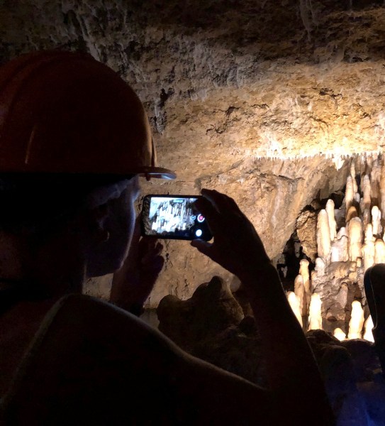 view of Harrison's cave in the dark with mood lighting