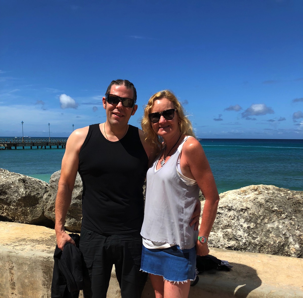 Me and Sarah cuddling with the sea behind us