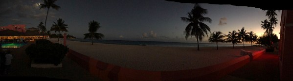 Panorama with a sunet in the far right and the moon on the far left