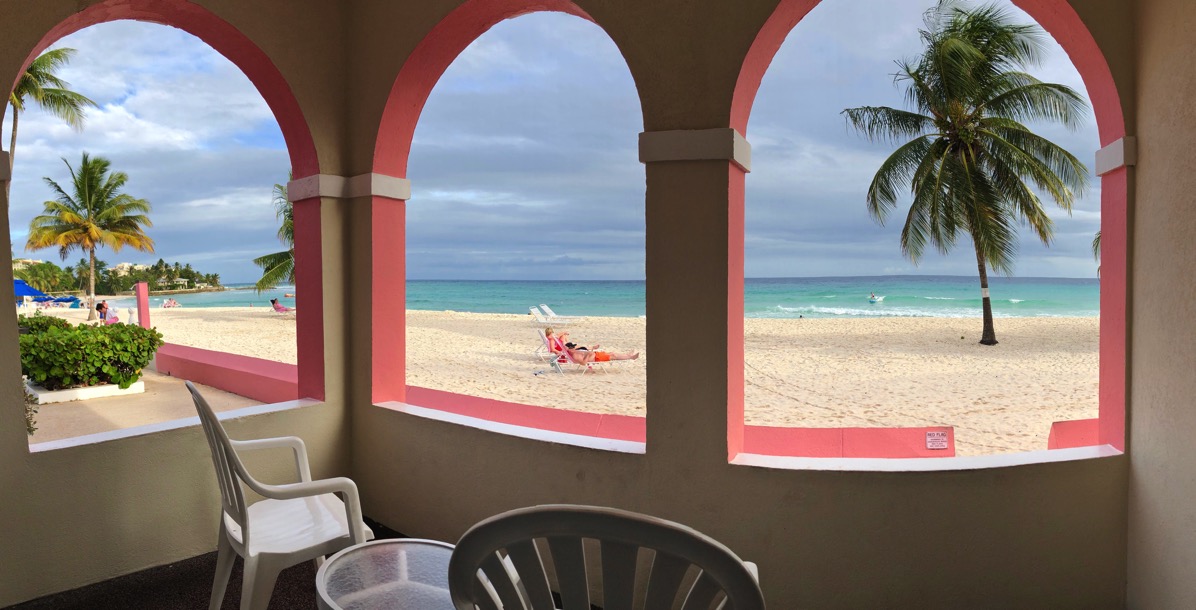 Room 112 Southern Palms view from the door to the balcony with the beach and palm trees as the landscape