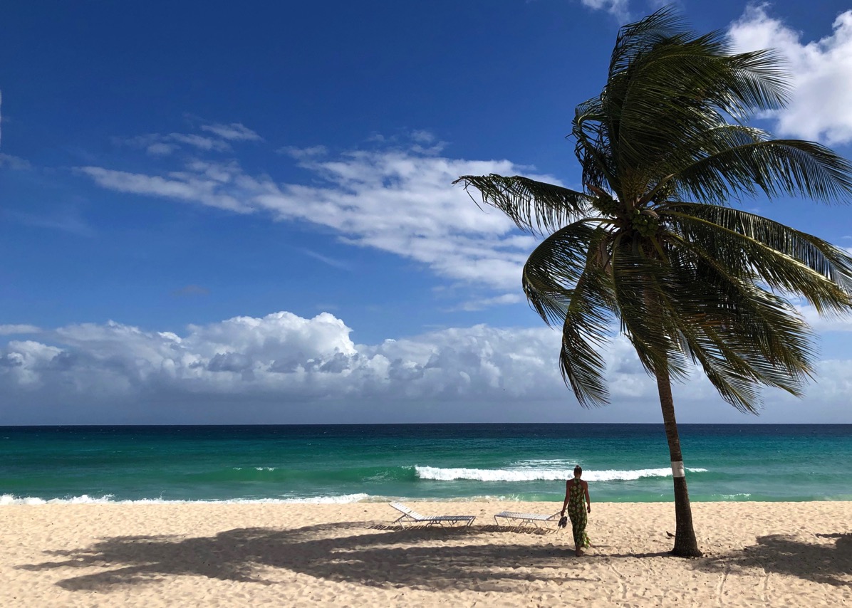 Sarah and the green dress on Dover beach in Barbados