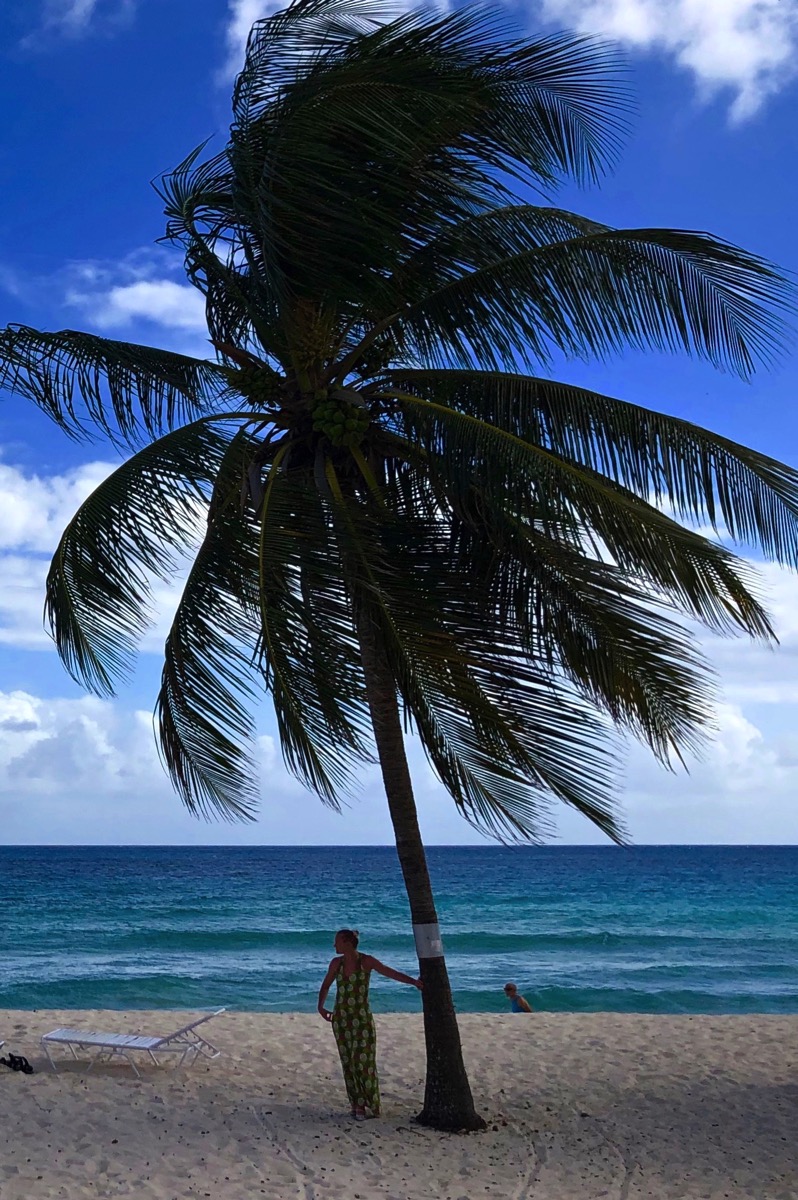 Sarah and the green dress on Dover beach in Barbados