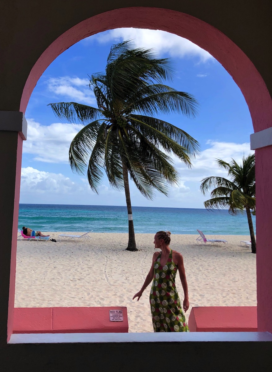 Sarah and the green dress on Dover beach in Barbados