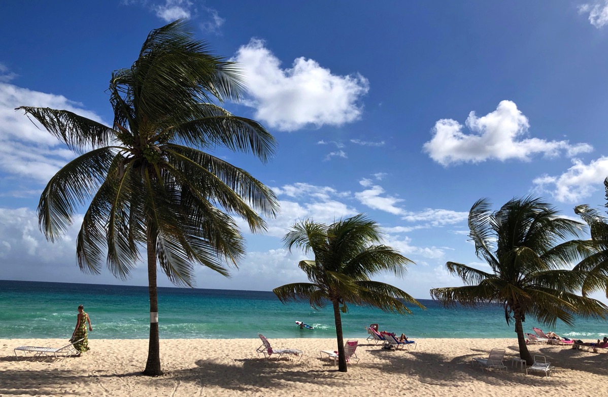 Sarah and the green dress on Dover beach in Barbados