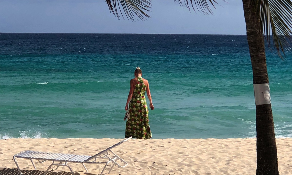 Sarah and the green dress walking on the beach