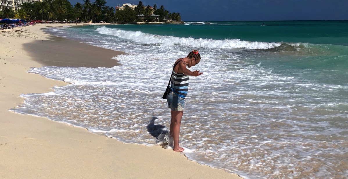 Sarah cooling her feet in the sea at dover beach