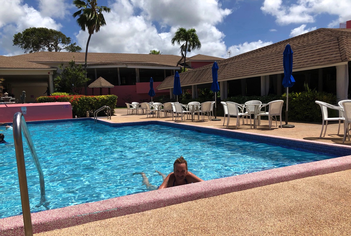 Sarah in the empty pool enjoying the sun