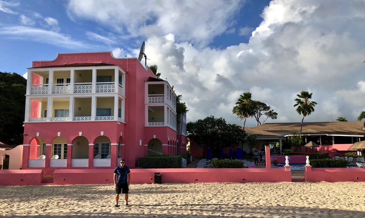 Southern palms hotel from the beach with palm trees and me in the front