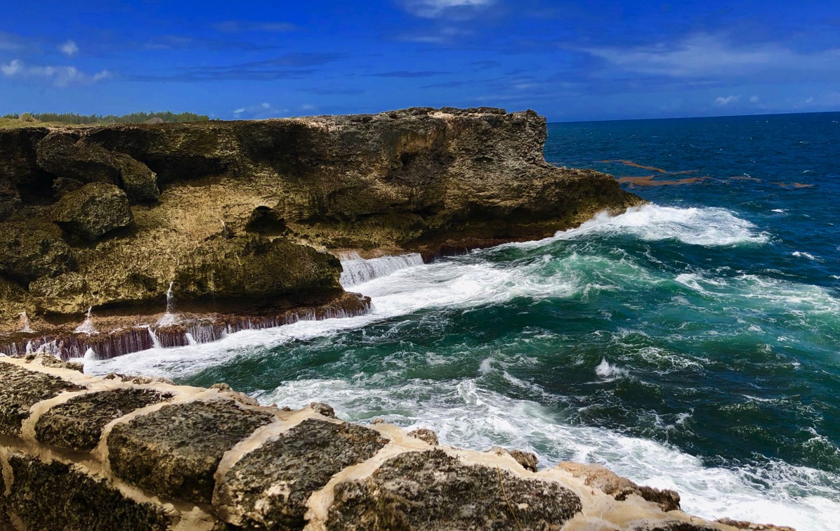 Waves crashing on the cliffs at north point
