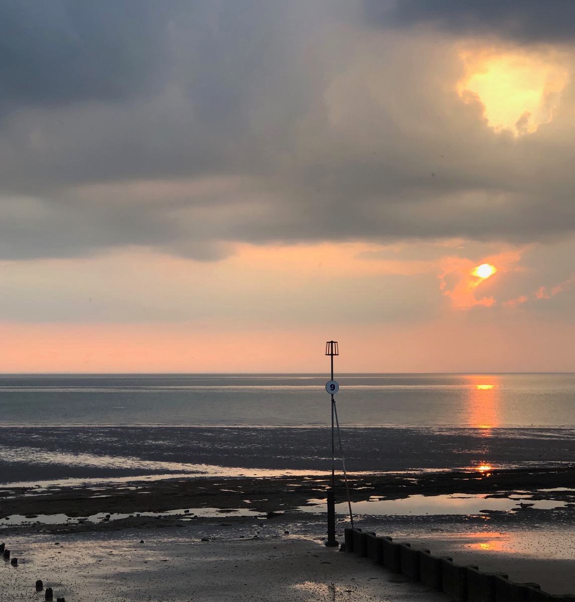 sunset looking out over the beach and the breakers