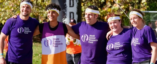 A photo of the hard as nails team with our headbands on and our arms around each other