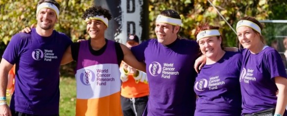 A photo of the hard as nails team with our headbands on and our arms around each other